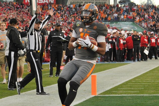 NASHVILLE, TN - DECEMBER 30:  Joshua Dobbs #11 of the University of Tennessee Volunteers rushes for a touchdown against the Nebraska Cornhuskers during the first half of the Franklin American Mortgage Music City Bowl at Nissan Stadium on December 30, 2016 in Nashville, Tennessee.  (Photo by Frederick Breedon/Getty Images)