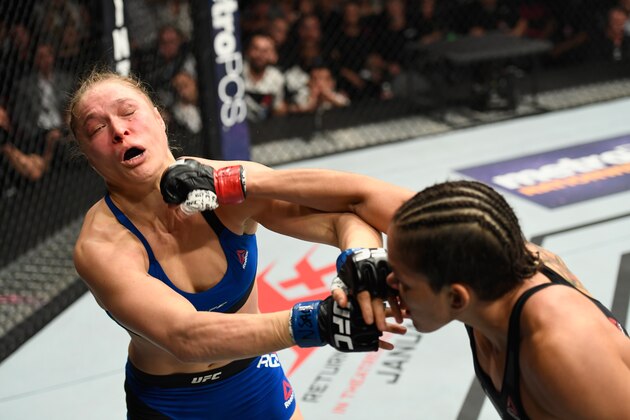 LAS VEGAS, NV - DECEMBER 30: (R-L) Amanda Nunes of Brazil punches Ronda Rousey in their UFC women's bantamweight championship bout during the UFC 207 event at T-Mobile Arena on December 30, 2016 in Las Vegas, Nevada.  (Photo by Josh Hedges/Zuffa LLC/Zuffa LLC via Getty Images)