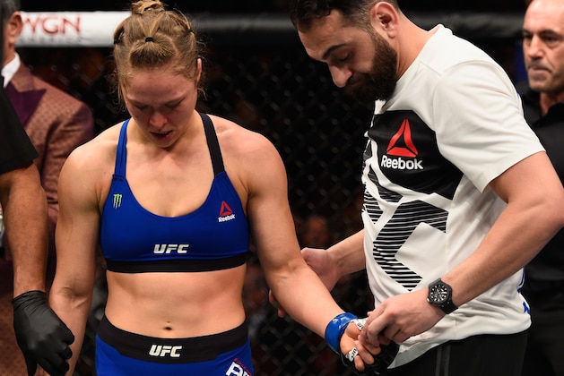LAS VEGAS, NV - DECEMBER 30:  Ronda Rousey (left) reacts to her loss to Amanda Nunes of Brazil in their UFC women's bantamweight championship bout during the UFC 207 event at T-Mobile Arena on December 30, 2016 in Las Vegas, Nevada.  (Photo by Jeff Bottari/Zuffa LLC/Zuffa LLC via Getty Images)