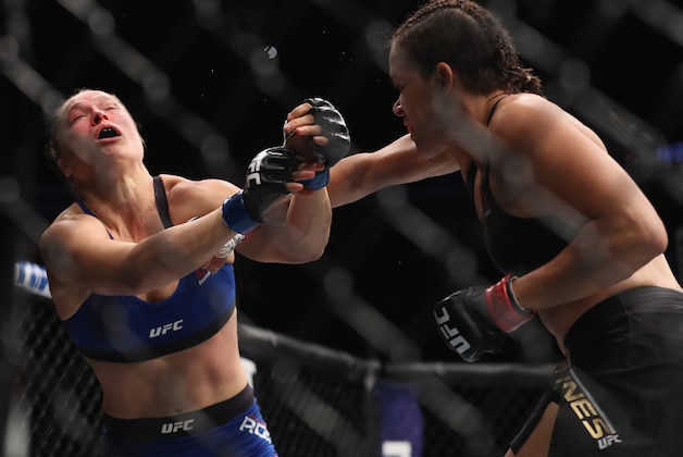 LAS VEGAS, NV - DECEMBER 30: (R-L) Amanda Nunes of Brazil punches Ronda Rousey in their UFC women's bantamweight championship bout during the UFC 207 event on December 30, 2016 in Las Vegas, Nevada.  (Photo by Christian Petersen/Getty Images)