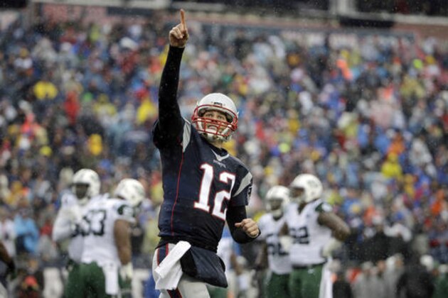 New England Patriots quarterback Tom Brady celebrates his touchdown pass to Martellus Bennett during the first half of an NFL football game against the New York Jets, Saturday, Dec. 24, 2016, in Foxborough, Mass. (AP Photo/Elise Amendola)