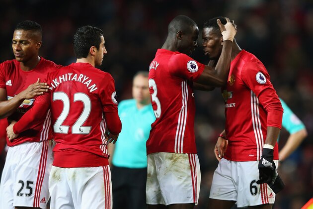 MANCHESTER, ENGLAND - DECEMBER 31:  Paul Pogba of Manchester United celebrates with team mate Eric Bailly after victory in the Premier League match between Manchester United and Middlesbrough at Old Trafford on December 31, 2016 in Manchester, England.  (Photo by Alex Livesey/Getty Images)