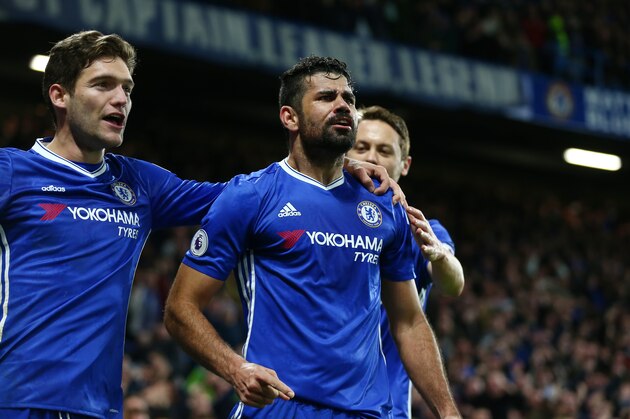 LONDON, ENGLAND - DECEMBER 31:  Diego Costa (C) of Chelsea celebrates scoring his team's fourth goal during the Premier League match between Chelsea and Stoke City at Stamford Bridge on December 31, 2016 in London, England.  (Photo by Steve Bardens/Getty Images)
