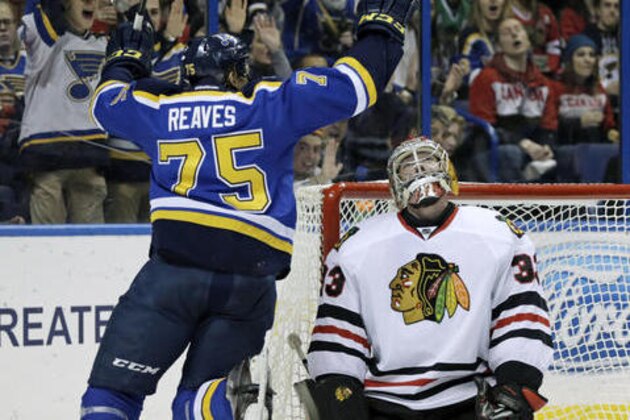 St. Louis Blues' Ryan Reaves (75) celebrates a goal by teammate Kyle Brodziak as Chicago Blackhawks goalie Scott Darling (33) reacts in the second period of an NHL hockey game, Saturday, Dec. 17, 2016, in St. Louis. (AP Photo/Tom Gannam)