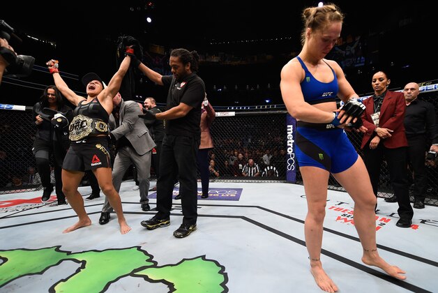 LAS VEGAS, NV - DECEMBER 30: Amanda Nunes of Brazil (left) reacts to her victory over Ronda Rousey (right) in their UFC women's bantamweight championship bout during the UFC 207 event at T-Mobile Arena on December 30, 2016 in Las Vegas, Nevada.  (Photo by Jeff Bottari/Zuffa LLC/Zuffa LLC via Getty Images)