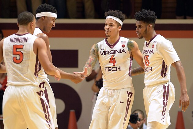 BLACKSBURG, VA - DECEMBER 31: Justin Robinson #5, Zach LeDay #32, Seth Allen #4 and Ahmed Hill #13 of the Virginia Tech Hokies react during their game against the Duke Blue Devils at Cassell Coliseum on December 31, 2016 in Blacksburg, Virginia. Virginia Tech won 89-75. (Photo by Lance King/Getty Images)