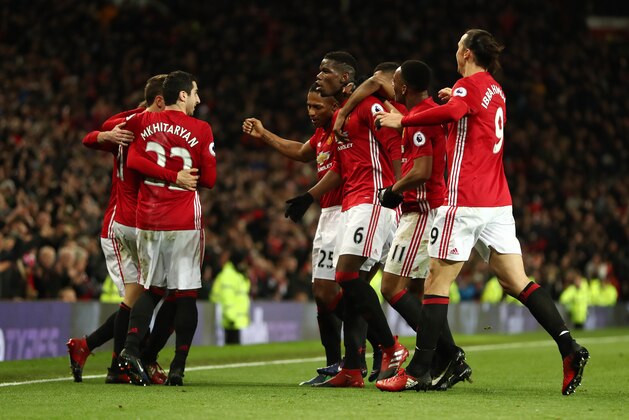 MANCHESTER, ENGLAND - DECEMBER 31: Paul Pogba of Manchester United celebrates with his team mates after scoring a goal to make it 2-1 during the Premier League match between Manchester United and Middlesbrough at Old Trafford on December 31, 2016 in Manchester, England. (Photo by James Baylis - AMA/Getty Images)