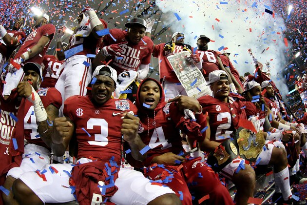 ATLANTA, GA - DECEMBER 31:  Players from the Alabama Crimson Tide celebrate after winning 24 to 7 against the Washington Huskies during the 2016 Chick-fil-A Peach Bowl at the Georgia Dome on December 31, 2016 in Atlanta, Georgia.  (Photo by Maddie Meyer/Getty Images)