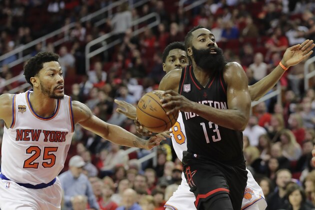 HOUSTON, TX - DECEMBER 31:  James Harden #13 of the Houston Rockets drives to the basket defended by Derrick Rose #25 of the New York Knicks in the first half at Toyota Center on December 31, 2016 in Houston, Texas. NOTE TO USER: User expressly acknowledges and agrees that, by downloading and or using this photograph, User is consenting to the terms and conditions of the Getty Images License Agreement.  (Photo by Tim Warner/Getty Images)