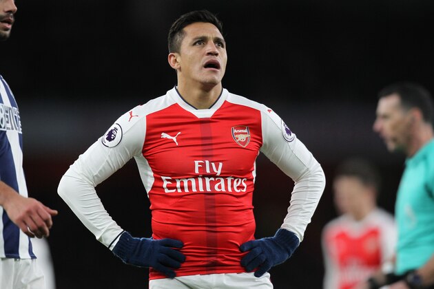 Arsenal's Chilean striker Alexis Sanchez reacts during the English Premier League football match between Arsenal and West Bromwich Albion at the Emirates Stadium in London on December 26, 2016.  / AFP / IAN KINGTON / RESTRICTED TO EDITORIAL USE. No use with unauthorized audio, video, data, fixture lists, club/league logos or 'live' services. Online in-match use limited to 75 images, no video emulation. No use in betting, games or single club/league/player publications.  /         (Photo credit should read IAN KINGTON/AFP/Getty Images)