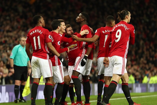 MANCHESTER, ENGLAND - DECEMBER 31: Paul Pogba of Manchester United celebrates with his team mates after scoring a goal to make it 2-1 during the Premier League match between Manchester United and Middlesbrough at Old Trafford on December 31, 2016 in Manchester, England. (Photo by James Baylis - AMA/Getty Images)