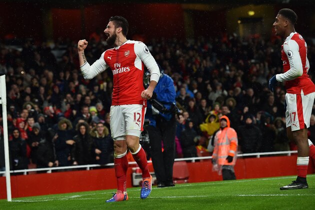Arsenal's French striker Olivier Giroud (L) celebrates scoring his team's first goal during the English Premier League football match between Arsenal and Crystal Palace at the Emirates Stadium in London on January 1, 2017.  / AFP / Glyn KIRK / RESTRICTED TO EDITORIAL USE. No use with unauthorized audio, video, data, fixture lists, club/league logos or 'live' services. Online in-match use limited to 75 images, no video emulation. No use in betting, games or single club/league/player publications.  /         (Photo credit should read GLYN KIRK/AFP/Getty Images)