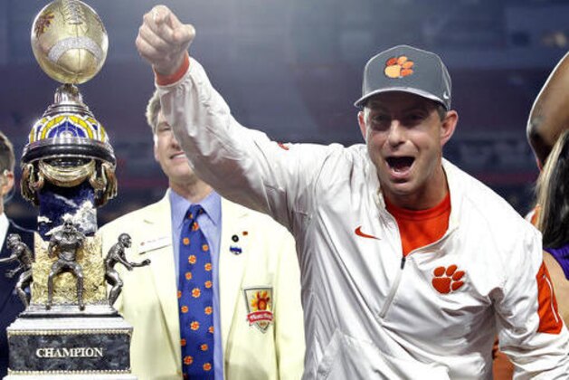 Clemson coach Dabo Swinney celebrates after the team's Fiesta Bowl NCAA college football playoff semifianl against Ohio State, Saturday, Dec. 31, 2016, in Glendale, Ariz. Clemson won 31-0 to advance to the BCS championship game Jan. 9 against Alabama. (AP Photo/Ross D. Franklin)