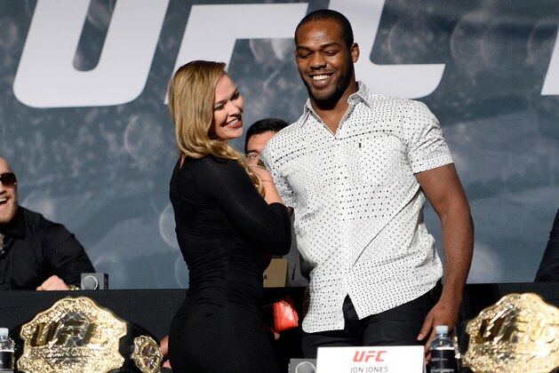 LAS VEGAS, NEVADA - NOVEMBER 17: UFC women's bantamweight champion Ronda Rousey (L) greets UFC light heavyweight champion Jon Jones during the UFC Time Is Now press conference at The Smith Center for the Performing Arts on November 17, 2014 in Las Vegas, Nevada. (Photo by Jeff Bottari/Zuffa LLC/Zuffa LLC via Getty Images) LAS VEGAS, NEVADA - NOVEMBER 17: UFC women's bantamweight champion Ronda Rousey (L) greets UFC light heavyweight champion Jon Jones during the UFC Time Is Now press conference at The Smith Center for the Performing Arts on November 17, 2014 in Las Vegas, Nevada. (Photo by Jeff Bottari/Zuffa LLC/Zuffa LLC via Getty Images)