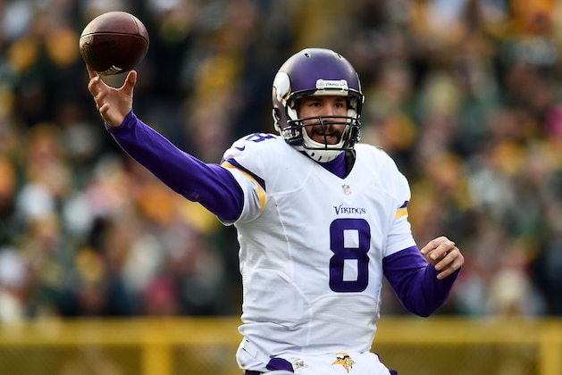 GREEN BAY, WI - DECEMBER 24:  Sam Bradford #8 of the Minnesota Vikings looks to pass during a game against the Green Bay Packers at Lambeau Field on December 24, 2016 in Green Bay, Wisconsin.  The Packers defeated the Vikings 38-25.  (Photo by Stacy Revere/Getty Images)