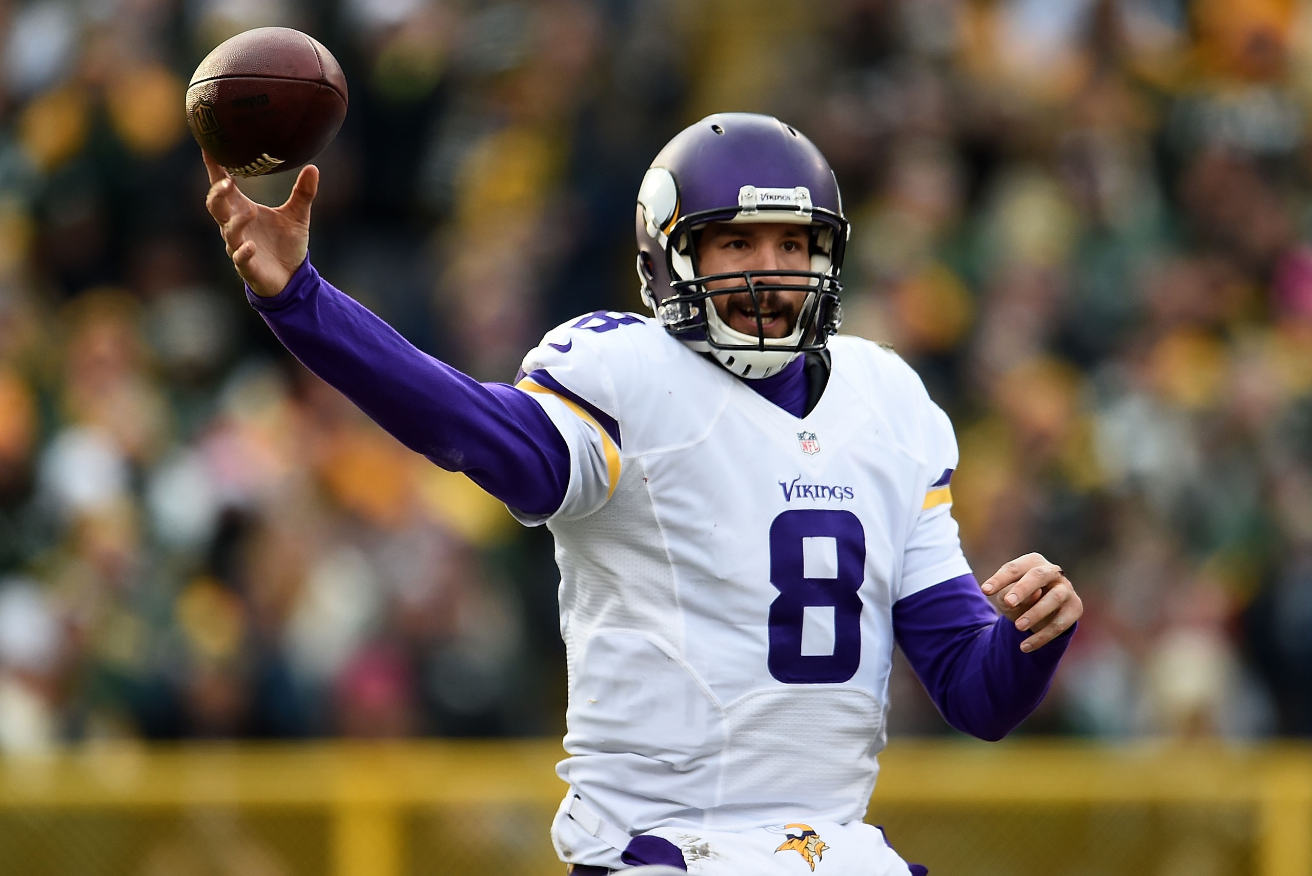 GREEN BAY, WI - DECEMBER 24:  Sam Bradford #8 of the Minnesota Vikings looks to pass during a game against the Green Bay Packers at Lambeau Field on December 24, 2016 in Green Bay, Wisconsin.  The Packers defeated the Vikings 38-25.  (Photo by Stacy Revere/Getty Images)