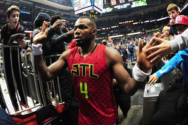 ATLANTA, GA - JANUARY 1: Paul Millsap #4 of the Atlanta Hawks is seen high fiving fans after the game against the San Antonio Spurs on January 1, 2017 at Philips Arena in Atlanta, Georgia.  NOTE TO USER: User expressly acknowledges and agrees that, by downloading and/or using this Photograph, user is consenting to the terms and conditions of the Getty Images License Agreement. Mandatory Copyright Notice: Copyright 2017 NBAE (Photo by Scott Cunningham/NBAE via Getty Images)