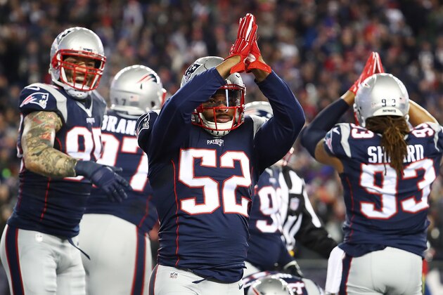 FOXBORO, MA - DECEMBER 12:  Chris Long #95 and Elandon Roberts #52 of the New England Patriots react after a safety during the first quarter against the Baltimore Ravens at Gillette Stadium on December 12, 2016 in Foxboro, Massachusetts.  (Photo by Adam Glanzman/Getty Images)