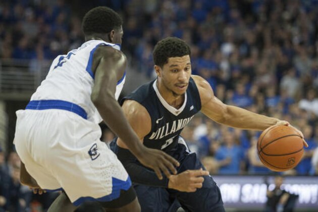 Villanova guard Josh Hart (3) dribbles the ball into lane with Creighton guard Khyri Thomas (2) guarding him during the first half of an NCAA college basketball game in Omaha, Neb., Saturday, Dec. 31, 2016. Villanova defeated Creighton 80-70. (AP Photo/John Peterson)