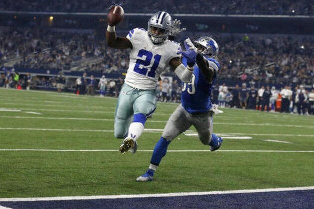 Dallas Cowboys' Ezekiel Elliott (21) leaps into the end zone after getting past Detroit Lions' Tahir Whitehead, rear, for a touchdown in the second half of an NFL football game, Monday, Dec. 26, 2016, in Arlington, Texas. (AP Photo/Michael Ainsworth)
