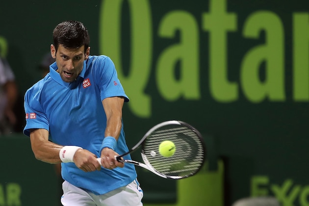 Serbia's Novak Djokovic returns the ball to Jan-Lennard Struff of Germany, during the ATP Qatar Open tennis competition in Doha on January 2, 2017.  / AFP / KARIM JAAFAR        (Photo credit should read KARIM JAAFAR/AFP/Getty Images)