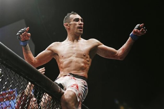 Tony Ferguson celebrates after defeating Edson Barboza in a lightweight bout during The Ultimate Fighter finale Friday, Dec. 11, 2015, in Las Vegas. (AP Photo/John Locher) Tony Ferguson celebrates after defeating Edson Barboza in a lightweight bout during The Ultimate Fighter finale Friday, Dec. 11, 2015, in Las Vegas. (AP Photo/John Locher)