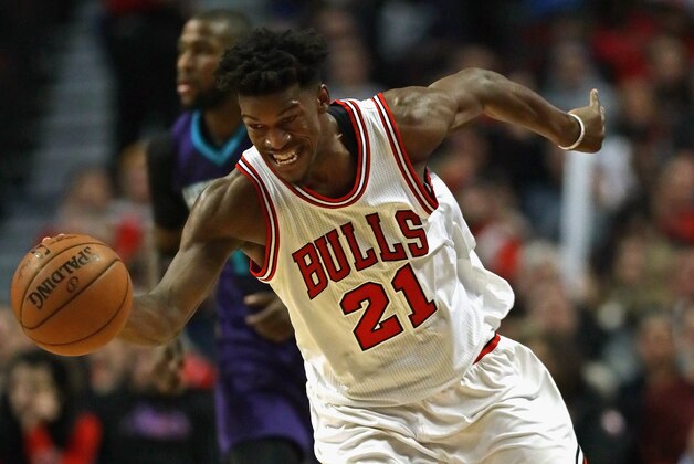 CHICAGO, IL - JANUARY 02: Jimmy Butler #21 of the Chicago Bulls chases down a loose ball against the Charlotte Hornets at the United Center on January 2, 2017 in Chicago, Illinois. The Bulls defeated the Hornets 118-111. The NOTE TO USER: User expressly acknowledges and agrees that, by downloading and/or using this photograph, user is consenting to the terms and conditions of the Getty Images License Agreement. (Photo by Jonathan Daniel/Getty Images)
