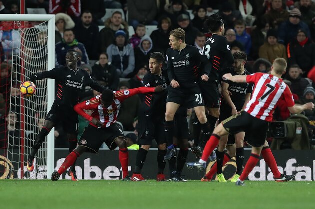 SUNDERLAND, ENGLAND - JANUARY 02: Sadio Mane of Liverpool concedes a penalty during the Premier League match between Sunderland and Liverpool at Stadium of Light on January 2, 2017 in Sunderland, England. (Photo by Ian MacNicol/Getty Images)