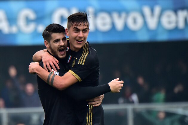 Juventus' forward from Spain Alvaro Morata (L) celebrates after scoring a goal with Juventus' forward from Argentina Paulo Dybala during the Serie A football match between Chievo Verona and Juventus on January 31, 2016 at Bentegodi Stadium in Verona.  / AFP / GIUSEPPE CACACE        (Photo credit should read GIUSEPPE CACACE/AFP/Getty Images)