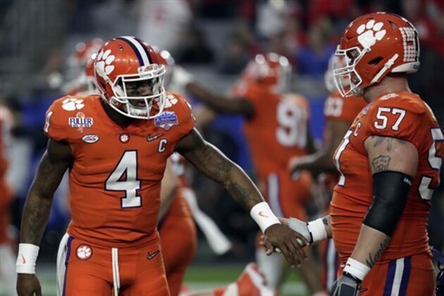 Clemson quarterback Deshaun Watson (4) and Jay Guillermo (57) during the Fiesta Bowl NCAA college football game against Ohio State, Saturday, Dec. 31, 2016, in Glendale, Ariz. (AP Photo/Rick Scuteri) Clemson quarterback Deshaun Watson (4) and Jay Guillermo (57) during the Fiesta Bowl NCAA college football game against Ohio State, Saturday, Dec. 31, 2016, in Glendale, Ariz. (AP Photo/Rick Scuteri)