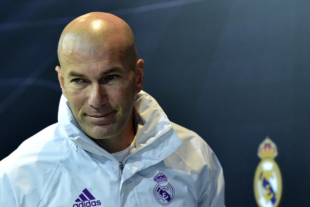 Real Madrid's French coach Zinedine Zidane leaves after giving a press conference at Valdebebas Sport City in Madrid on January 3, 2017, on the eve of the Spanish Copa del Rey (King's Cup) match Real Madrid CF vs Sevilla FC. / AFP / GERARD JULIEN        (Photo credit should read GERARD JULIEN/AFP/Getty Images)