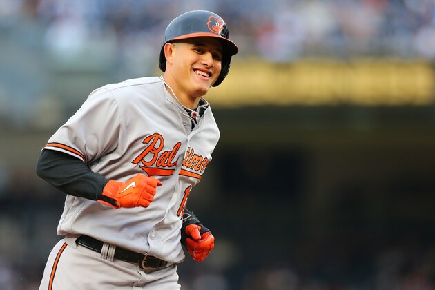 NEW YORK, NY - OCTOBER 02:  Manny Machado #13 of the Baltimore Orioles celebrates Matt Wieters #32 second two run home run of the game as he rounds second base in the sixth inning against the New York Yankees at Yankee Stadium on October 2, 2016 in the Bronx borough of New York City. Baltimore Orioles defeated the New York Yankees 5-2.  (Photo by Mike Stobe/Getty Images)