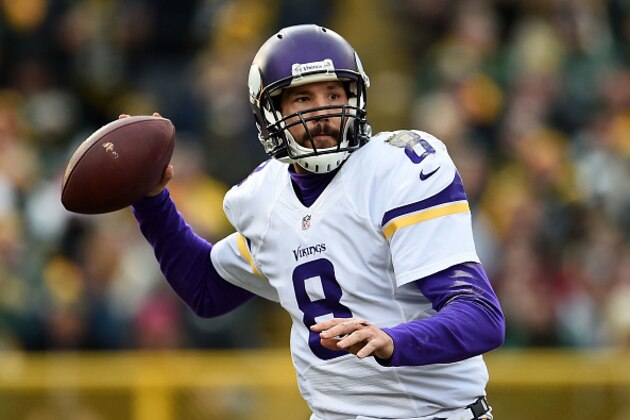 GREEN BAY, WI - DECEMBER 24:  Sam Bradford #8 of the Minnesota Vikings looks to pass during a game against the Green Bay Packers at Lambeau Field on December 24, 2016 in Green Bay, Wisconsin.  The Packers defeated the Vikings 38-25.  (Photo by Stacy Revere/Getty Images)