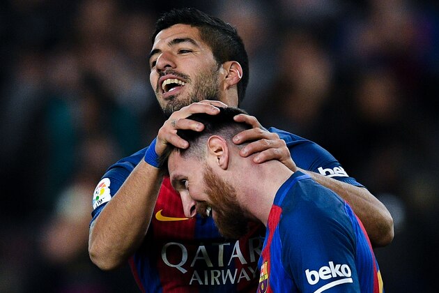 BARCELONA, SPAIN - DECEMBER 18:  Luis Suarez of FC Barcelona celebrates with his team mate Lionel Messi after scoring his team's second goal during the La Liga match between FC Barcelona and RCD Espanyol at the Camp Nou stadium on December 18, 2016 in Barcelona, Spain.  (Photo by David Ramos/Getty Images)