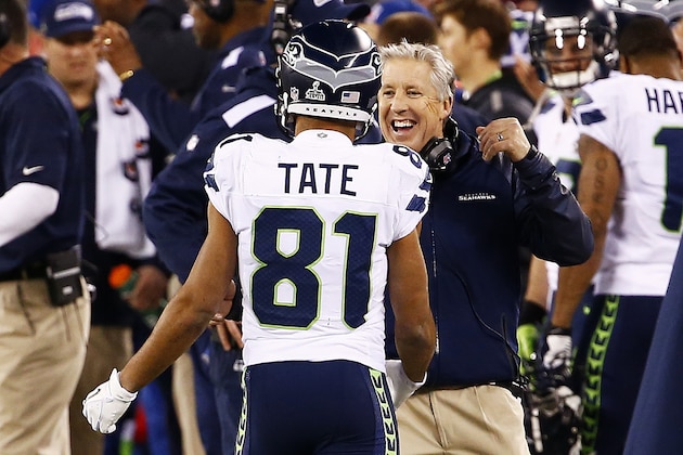 EAST RUTHERFORD, NJ - FEBRUARY 02:  Head coach Pete Carroll  of the Seattle Seahawks celebrates with wide receiver Golden Tate #81 of the Seattle Seahawks after Super Bowl XLVIII at MetLife Stadium on February 2, 2014 in East Rutherford, New Jersey. The Seahawks beat the Broncos 43-8.  (Photo by Tom Pennington/Getty Images)