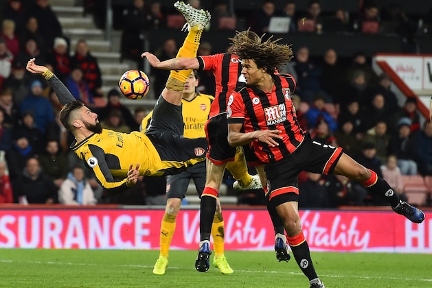Arsenal's French striker Olivier Giroud (L) fails to connect with this overhead shot during the English Premier League football match between Bournemouth and Arsenal at the Vitality Stadium in Bournemouth, southern England on January 3, 2017. / AFP / Glyn KIRK / RESTRICTED TO EDITORIAL USE. No use with unauthorized audio, video, data, fixture lists, club/league logos or 'live' services. Online in-match use limited to 75 images, no video emulation. No use in betting, games or single club/league/player publications.  /         (Photo credit should read GLYN KIRK/AFP/Getty Images)