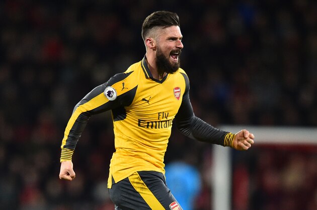Arsenal's French striker Olivier Giroud celebrates after Arsenal score their second goal during the English Premier League football match between Bournemouth and Arsenal at the Vitality Stadium in Bournemouth, southern England on January 3, 2017. / AFP / Glyn KIRK / RESTRICTED TO EDITORIAL USE. No use with unauthorized audio, video, data, fixture lists, club/league logos or 'live' services. Online in-match use limited to 75 images, no video emulation. No use in betting, games or single club/league/player publications.  /         (Photo credit should read GLYN KIRK/AFP/Getty Images)