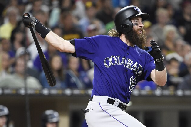 SAN DIEGO, CALIFORNIA - SEPTEMBER 9:  Charlie Blackmon #19 of the Colorado Rockies hits a two-run home run during the third inning of a baseball game against the San Diego Padres at PETCO Park on September 9, 2016 in San Diego, California.  (Photo by Denis Poroy/Getty Images)