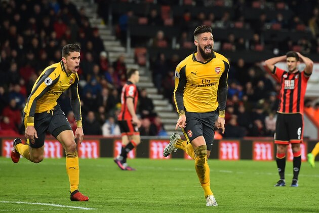 Arsenal's French striker Olivier Giroud (2nd R) and Arsenal's Brazilian defender Gabriel (L) celebrate as Bournemouth's South African-born English midfielder Andrew Surman (R) reacts after Giroud scores their third goal during the English Premier League football match between Bournemouth and Arsenal at the Vitality Stadium in Bournemouth, southern England on January 3, 2017.
The game finished 3-3. / AFP / Glyn KIRK / RESTRICTED TO EDITORIAL USE. No use with unauthorized audio, video, data, fixture lists, club/league logos or 'live' services. Online in-match use limited to 75 images, no video emulation. No use in betting, games or single club/league/player publications.  /         (Photo credit should read GLYN KIRK/AFP/Getty Images)