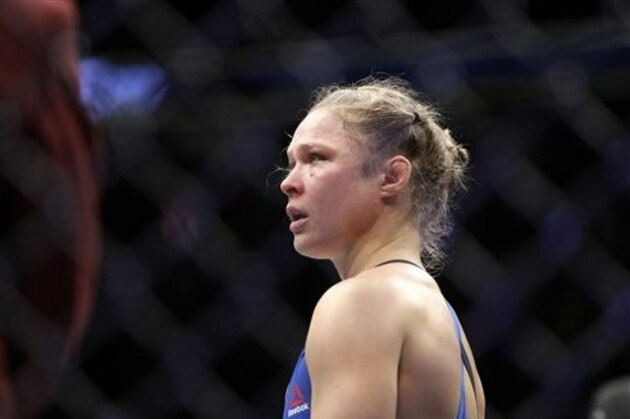 Ronda Rousey reacts after losing her women's bantamweight championship mixed martial arts bout with Amanda Nunes at UFC 207, Friday, Dec. 30, 2016, in Las Vegas. (AP Photo/John Locher)