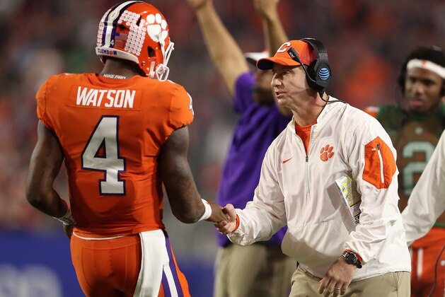 GLENDALE, AZ - DECEMBER 31:  Head coach Dabo Swinney (R) of the Clemson Tigers congraulates quarterback Deshaun Watson #4 after he scored on a one yard rushing touchdown against the Ohio State Buckeyes during the Playstation Fiesta Bowl at University of Phoenix Stadium on December 31, 2016 in Glendale, Arizona. The Tigers defeated the Buckeyes 31-0.  (Photo by Christian Petersen/Getty Images)