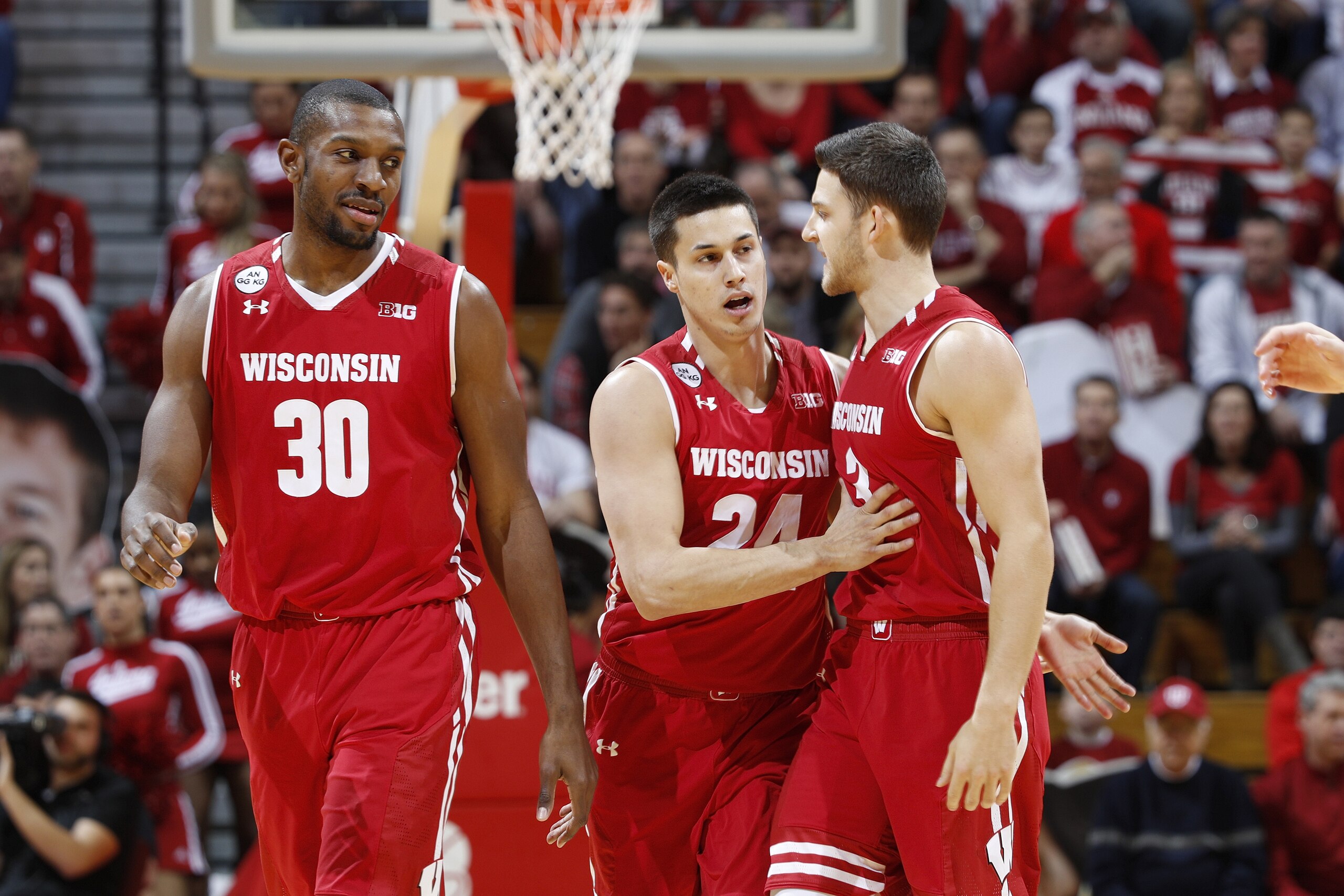 BLOOMINGTON, IN - JANUARY 03: Bronson Koenig #24 of the Wisconsin Badgers celebrates with Vitto Brown #30 and Zak Showalter #3 after hitting a three-point shot against the Indiana Hoosiers in the first half of the game at Assembly Hall on January 3, 2017 in Bloomington, Indiana. (Photo by Joe Robbins/Getty Images)