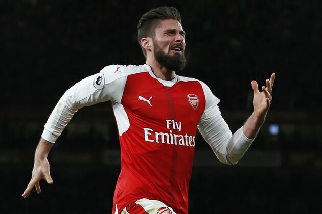 Arsenal's French striker Olivier Giroud celebrates after scoring the opening goal of the English Premier League football match between Arsenal and West Bromwich Albion at the Emirates Stadium in London on December 26, 2016. 
Arsenal won the game 1-0. / AFP / IAN KINGTON / RESTRICTED TO EDITORIAL USE. No use with unauthorized audio, video, data, fixture lists, club/league logos or 'live' services. Online in-match use limited to 75 images, no video emulation. No use in betting, games or single club/league/player publications.  /         (Photo credit should read IAN KINGTON/AFP/Getty Images)