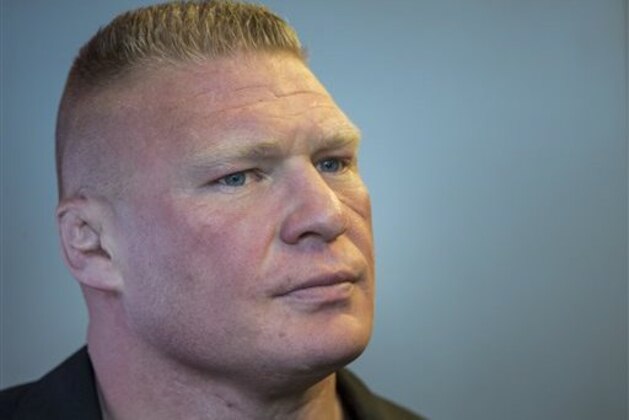 Former UFC heavyweight champion Brock Lesnar pauses for a photo after ruling out a return to mixed martial arts, ending three years of speculation about the biggest pay-per-view star in the sport's history, as he announced he had re-signed with WWE in an interview on ESPN's