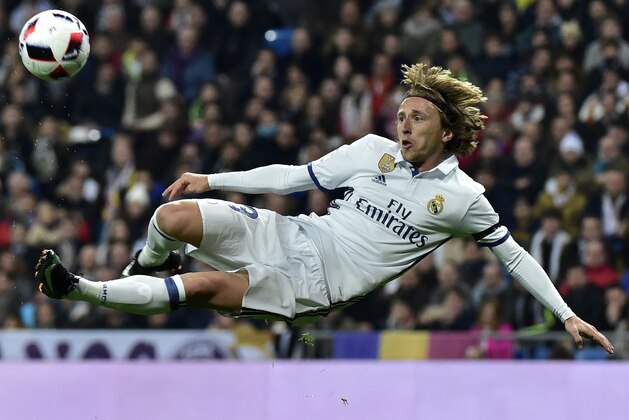 Real Madrid's Croatian midfielder Luka Modric kicks a ball during the Spanish Copa del Rey (King's Cup) round of 16 first leg football match Real Madrid CF vs Sevilla FC at the Santiago Bernabeu stadium in Madrid on January 4, 2017. / AFP / GERARD JULIEN        (Photo credit should read GERARD JULIEN/AFP/Getty Images)