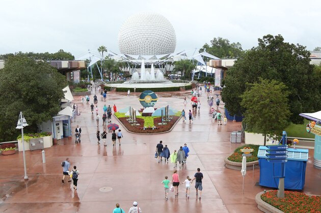 People leave the Epcot center, after it closed in Orlando, Florida in preparation for the landfall of Hurricane Matthew, on October 6, 2016. 
Some three million people on the US southeast coast faced an urgent evacuation order Thursday as monstrous Hurricane Matthew -- now blamed for more than 100 deaths in Haiti alone -- bore down for a direct hit on Florida.
 / AFP / Gregg Newton        (Photo credit should read GREGG NEWTON/AFP/Getty Images)