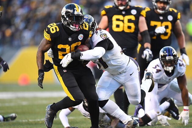 PITTSBURGH, PA - DECEMBER 25:  Le'Veon Bell #26 of the Pittsburgh Steelers rushes against the Baltimore Ravens in the first quarter during the game at Heinz Field on December 25, 2016 in Pittsburgh, Pennsylvania. (Photo by Joe Sargent/Getty Images)