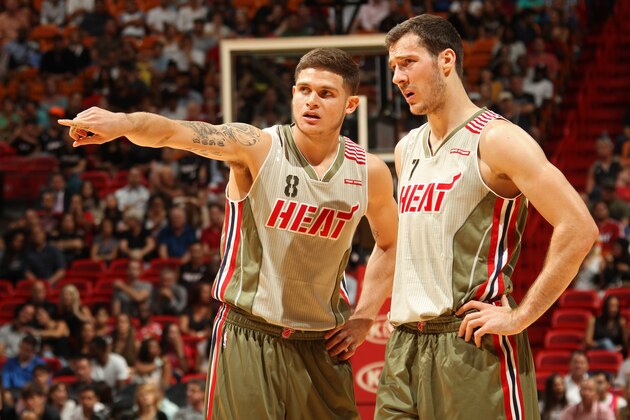 MIAMI, FL - NOVEMBER 12:  Tyler Johnson #8 and Goran Dragic #7 of the Miami Heat talk during the game against the Utah Jazz on November 12, 2015 at American Airlines Arena in Miami, Florida. NOTE TO USER: User expressly acknowledges and agrees that, by downloading and or using this Photograph, user is consenting to the terms and conditions of the Getty Images License Agreement. Mandatory Copyright Notice: Copyright 2015 NBAE (Photo by Issac Baldizon/NBAE via Getty Images)