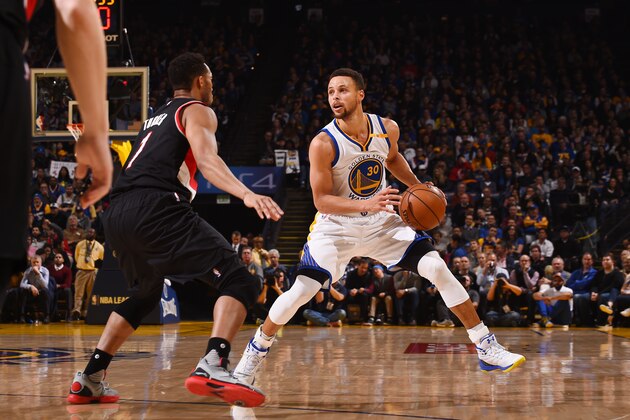 OAKLAND, CA - JANUARY 4:  Stephen Curry #30 of the Golden State Warriors handles the ball against the Portland Trail Blazers during the game on January 4, 2017 at ORACLE Arena in Oakland, California. NOTE TO USER: User expressly acknowledges and agrees that, by downloading and or using this photograph, user is consenting to the terms and conditions of Getty Images License Agreement. Mandatory Copyright Notice: Copyright 2017 NBAE (Photo by Noah Graham/NBAE via Getty Images)