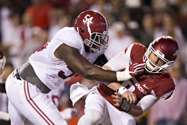 FAYETTEVILLE, AR - OCTOBER 8:  Dalvin Tomlinson #54 of the Alabama Crimson Tide shoves Austin Allen #8 of the Arkansas Razorbacks after throwing a pass at Razorback Stadium on October 8, 2016 in Fayetteville, Arkansas.  The Crimson Tide defeated the Razorbacks 49-30.  (Photo by Wesley Hitt/Getty Images)